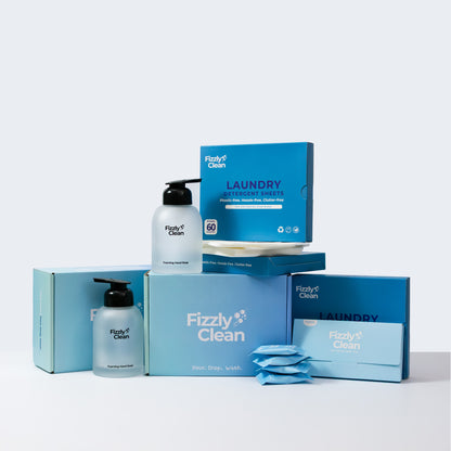 Fizzyly Clean laundry sheets including bottles and packaging on a light gray background